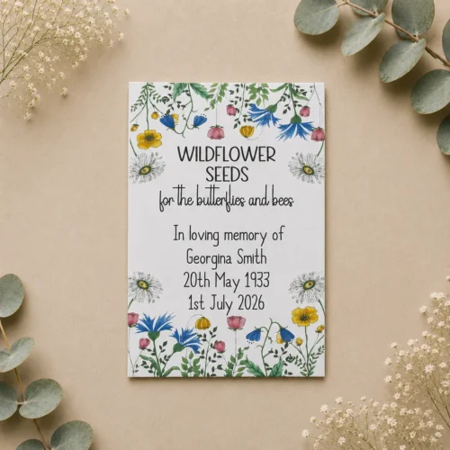 White personalised wildflower funeral seed packet featuring delicate flowers and a personalised remembrance message.