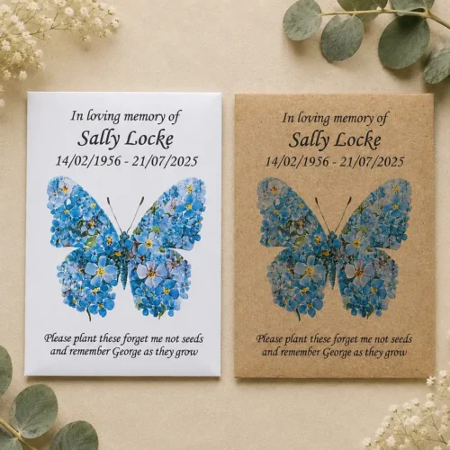 White and kraft personalised funeral seed packets featuring a blue forget-me-not butterfly design on a beige botanical background.