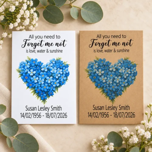 personalised forget me not heart funeral seed packets featuring a heart made from blue forget me not flowers. Personalised with a loved one's name and dates, creating a thoughtful keepsake for family and friends.